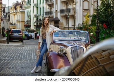 girl on the background of the car posing