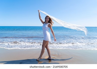 Girl On The Beach, Beautiful Woman With White Scarf On Summer Beach, Freedom And Relaxation, Fire Movement - Financial Independence Retire Early Concept