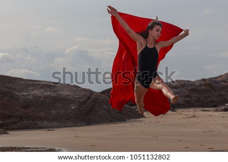 The girl on the beach whith red cloth