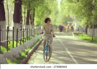 Girl On A Bicycle Spring Morning