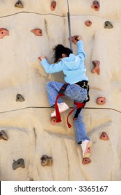 Girl On Climbing Wall