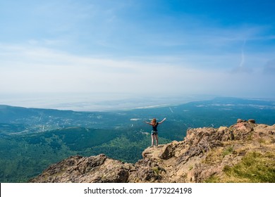 Girl On The Edge Of Flattop Mountain Trail On A Sunny Summer Day,  Anchorage, Alaska, USA.