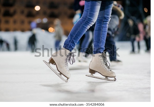 the\
girl on the figured skates on a opened skating\
rink