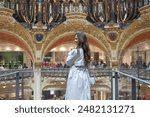 Girl on the observation balcony at the Galeries Lafayette in Paris