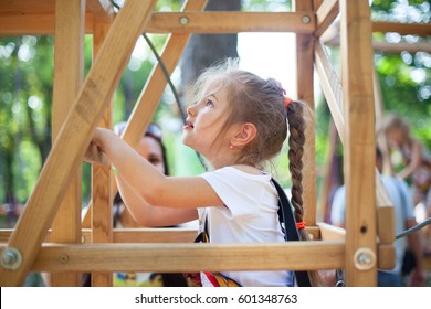 girl on the obstacle course, high ropes course, summer, joy, health, good morning - Powered by Shutterstock