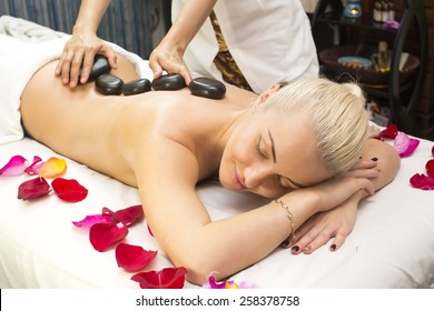 girl on procedure Balinese massage in the beauty salon