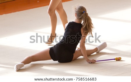 Similar – Image, Stock Photo Woman stretching on yoga mat in a yoga studio