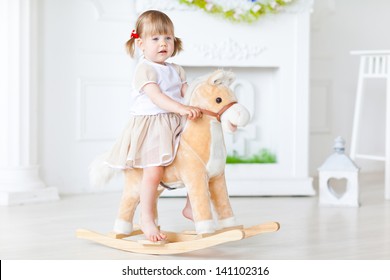 Girl On A Rocking Horse