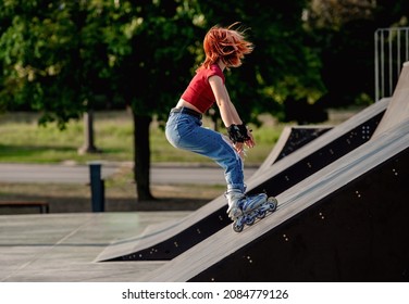Girl on roller skates riding extremely at park ramp. Female teenager rollerblading in city at summer