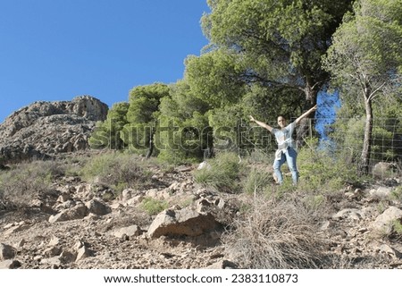 
girl on the route reaching the top of the Sierra Elvira mountain in Granada