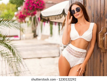 girl on a tropical beach at sunset 