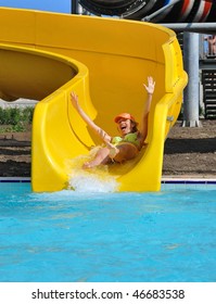 Girl On A Waterslide In The Aquapark