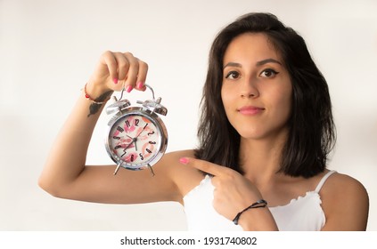 Girl On White Background Holding Clock