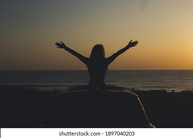 Girl With Open Arms In Car