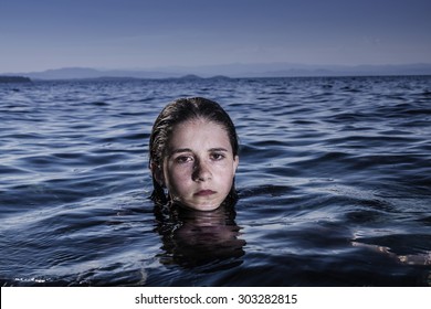 Girl out of the sea with wet hair and skin