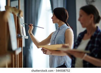 Girl painting - Shutterstock ID 544508752