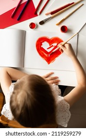 Girl Painting Red Heart Card For Valentines Day On White Table, Crafting, Top View, Copy Space, Love, Valentines Day And Mothers Day Concept, Lifestyle