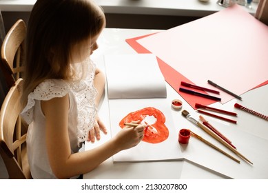 Girl Painting Red Heart Card For Valentines Day On White Table, Crafting, Top View, Copy Space, Love, Valentines Day And Mothers Day Concept, Lifestyle