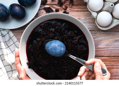 The Girl Paints Easter Eggs With Natural Dye At Home. The Process Of Dyeing Eggs With Natural Food Coloring. Preparation For Easter. Close-up. Top View. Selective Focus.