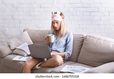 Girl In Pajama And Mask For Sleeping Work At Home With Laptop And Charts