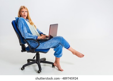 girl in pajamas with a laptop - Shutterstock ID 489745924