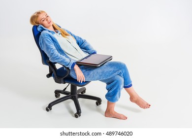 girl in pajamas with a laptop - Shutterstock ID 489746020