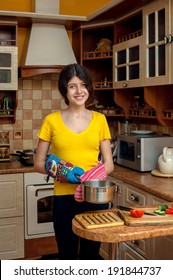 Girl With Pan Cooking Dinner In The Kitchen