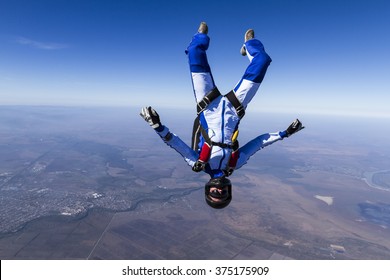 The girl parachutist in free fall.