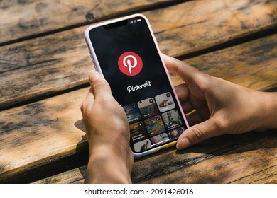 Girl In The Park Holding A Smartphone With Pinterest App On The Screen. Rio De Janeiro, RJ, Brazil. December 2021.