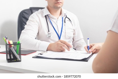 Girl Patient Signs Consent Documents For Surgical Operation Under Anesthesia. Medical Responsibility Concept, Consultation