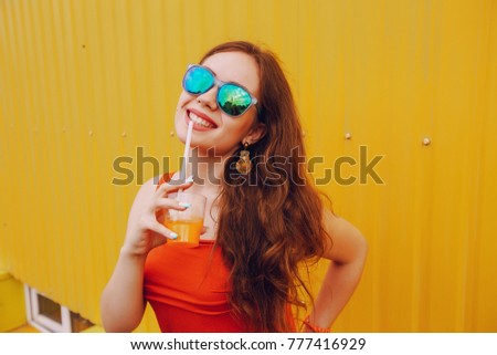 girl photographed with fruit uses the means of communication sitting in cafe