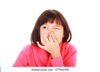 Girl pinches her nose