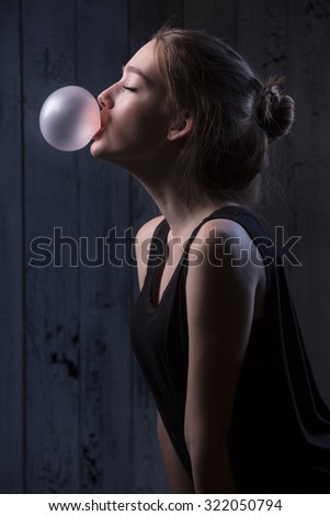 Similar – Young teenage girl blowing pink bubble gum