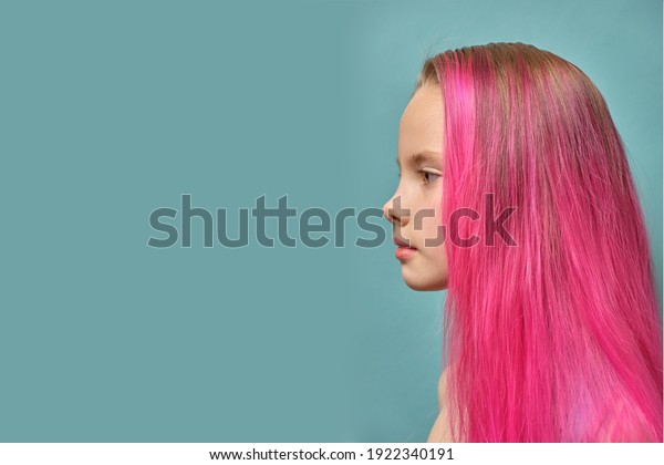 a girl with pink hair. Model with the colored chips. A\
woman with a voluminous hairstyle and beautiful large lips, a side\
view in profile of a beautiful girl of model appearance. mock\
up