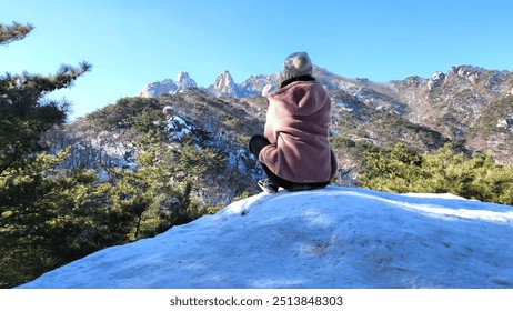 girl in a pink sweater on top of a snowy mountain. Image of winter scenery of Dobongsan Mountain, Seoul, Korea. Hiking. winter mountain landscapes. korea mountains. trekking. bukhansan national park. - Powered by Shutterstock