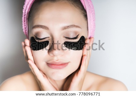girl with a pink towel on her head with closed eyes