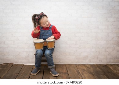 Girl to play the bongos - Powered by Shutterstock