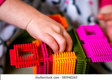 Girl Play With Colorful Bristle Block.