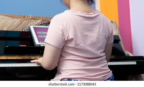 Girl Play Piano By Online Learning