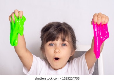 Girl Play With Slime. Kid Squeeze And Stretching Toy Slime.