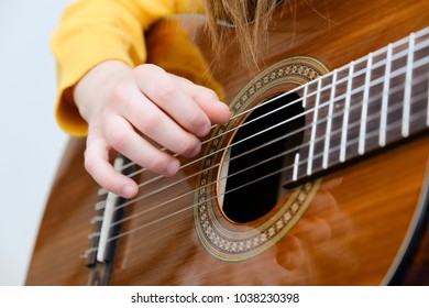 Girl Playing Acustic Guitar, Closeup Shot