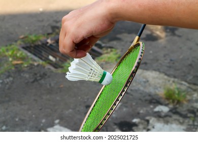 Girl Playing Badminton At Front House