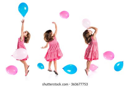 Girl playing with balloons
