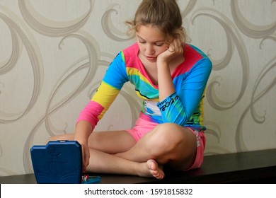 Girl Playing In The Board Game Battleship, Toy War Ships And Submarine. Selective Focus.