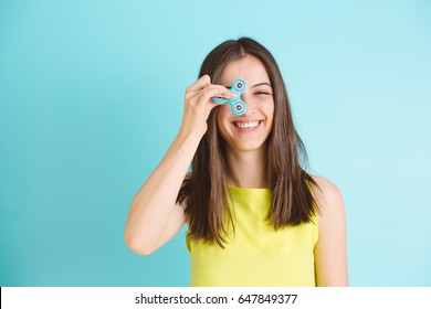 Girl playing with a fidget spinner