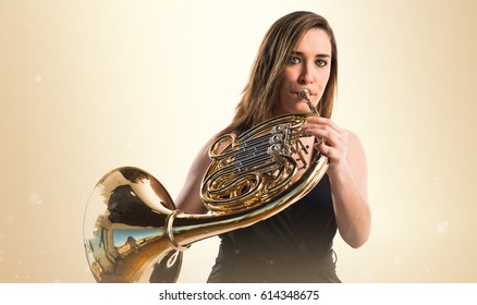 Girl Playing The French Horn