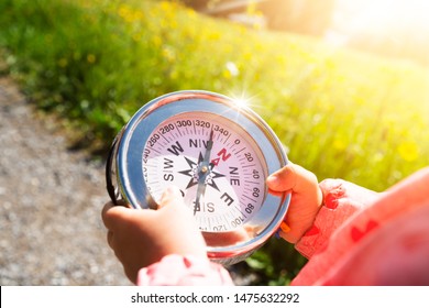 Girl Playing Geocaching Game In Mountains In Summer