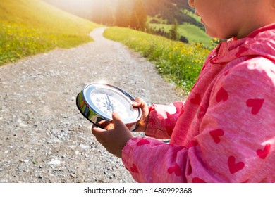 Girl Playing Geocaching Game In Mountains In Summer