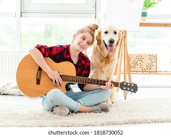 Girl Playing Guitar With Lovely Dog