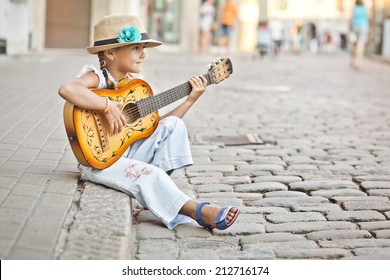 Girl Playing Guitar On The Street